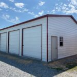 30x50x12 side entry garage with four 10x10 roll up doors
