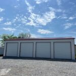 Metal Garages- Big Stone Gap VA 30x50x12 side entry garage with four 10x10 roll up doors